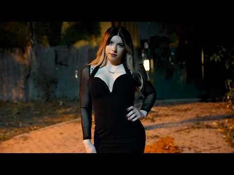 Blonde crossdresser in tight dress outdoors