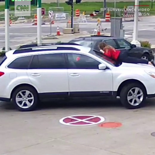 Harrowing security footage shows a woman fighting off car thieves by jumping on the hood of her car http://cnn.it/2qSYkgD | CNN