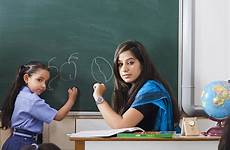 teacher indian classroom teaching student school little girl blackboard writing stock