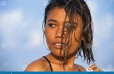 bikini asian holidays beach enjoying posing tropical smiling wet cool happy hair young beautiful girl