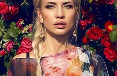 blond posing woman hair beautiful rose garden sunglasses swimsuit beach stock