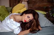 lying bed brunette front wallpaper model women looking viewer lipstick bare shoulders red indoors shirt hd wallhere