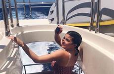 kylie jenner swimsuit bikini swimwear thejasminebrand swimsuits baby holiday dior celebrity beach stormi travis scott social sexy her boat instagram