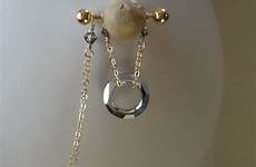 nipple rings chains pierced