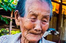 old woman man face thailand portrait facial hair citizen expression grandparent hairstyle senior smile person male head color blue people