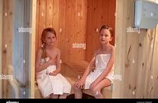sauna girls finnish towels two wrapped themselves sitting alamy