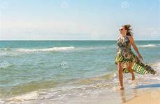 running along against sky sea pretty woman dress beach resting wonderful dreamstime beautiful preview jogging coast
