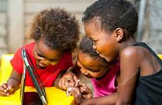 african kids having fun tablet threesome stock playing digital depositphotos