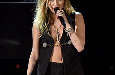 miley cyrus sexy grammys shawn mendes performance her grammy outfit during night stage biceps last popsugar wore she entertainment getty