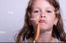 eating young girl carrots fresh sweet background alamy child