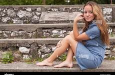 sitting girl teenage stone outdoors steps stock alamy