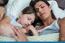 daughter sleeping mother bedroom together stock preview
