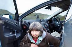 outside woman car urinating squatting alamy wilds stock shopping cart