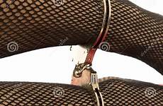 cuffs fishnet legs close woman preview