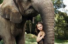 amelia girl elephants friends giraffes animal has showing trunk poses hanging photographer old daughter lifts