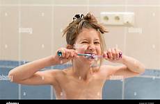 girl little brushes teeth two alamy