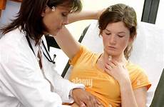 doctor examining abdomen palpation female teenager alamy stock