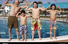pool grandpa boys muscles showing alamy