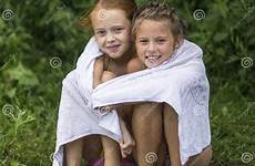 girls little beach naughty towel lake bathe sitting summer two stock family swimming after