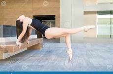 ballerina flexible rehearsing urban scene stretching