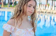 teen cute girl pool long dress hair standing romantic bridge preview