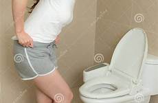 girl bathroom pants standing off diarrhea urgent stomach ache taking stock