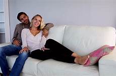 couple couch relaxing cute living together room shutterstock
