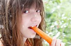 carrot girl teenage enjoys breakfast alamy garden after