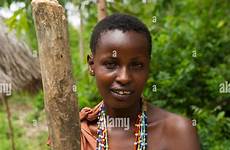 woman kikuyu kenya village pounding maize alamy