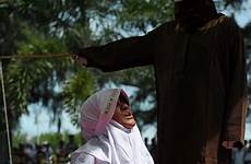 punishment caning men women man caned woman law adultery muslim public who indonesia under allowed person brutal sharia offence spouses