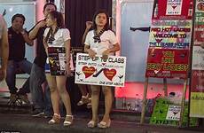 bar girls thai thailand signs sex pattaya light red price trafficking trade busy bars prostitute street child drink two women