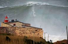 wave surfer surfing nazare