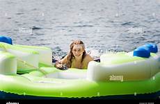 raft inflatable woman stock girl alamy teenage lake