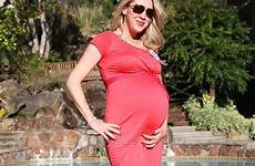 pregnant blond woman pool young stock