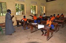 uganda school schools finally back masks operating guidelines strict distancing covid physical wearing under face