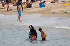 burkini france beach muslim suit bathing ban french woman hijab face only turkey exposed swimsuit leaves hands feet town wears