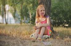 little girl crying sitting tree stock storyblocks footage smeared holi colours