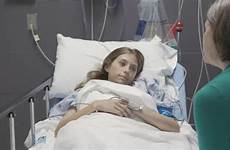 sick girl teenage hospital bed lying shot stock talking dissolve