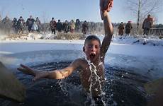 boy cold epiphany ice orthodox water most belarus week lake plunge icy christians village