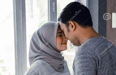 muslim kissing wife husband each other