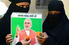 modi muslim muslims indian hindu women india narendra bjp party victory bharatiya janata portrait candidate sweets ministerial victorious hold prime
