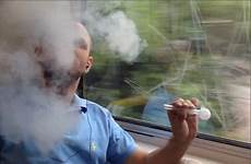man smoking ice drug train pipe smoke glass shocking holding openly suburban shaven passengers australian camera footage vile headed lighter