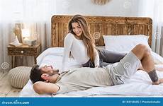 man woman bedroom bed talking women interior relationship happy