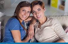 homosexual women lesbian couple hugging couch preview people