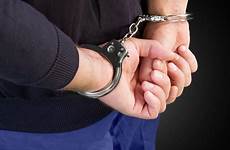 handcuffs handcuffed person hands man arrested behind back hith
