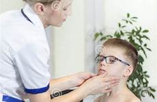 doctor boy office medical examining tonsils glasses while preview