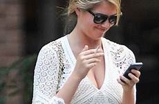 kate upton cigarette her hairstylist smoking cleavage dress leggy puffs city legs stroll famous short hot during alongside frock stole