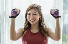 asian pregnant woman beautiful belly dumbbell attractive exercising workout smile standing windows near happy big feeling chinese