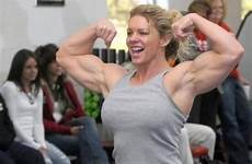 flexing biceps female abs bodybuilder muscular