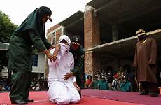 woman public sex caned having punishment young indonesian muslim outside marriage whipped whipping aceh stage her man she indonesia forced